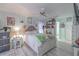 This bright bedroom features a large bed, whimsical decor and attached bathroom at 2533 Blossom Lake Dr, Holiday, FL 34691