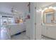 Charming bedroom features an ensuite bath and outdoor access at 2533 Blossom Lake Dr, Holiday, FL 34691