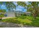 Charming single-Gathering home with a well-maintained lawn and colorful exterior design at 2533 Blossom Lake Dr, Holiday, FL 34691