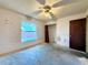 Bedroom featuring a ceiling fan, closet, and a window providing natural light at 2800 13Th N Ave, St Petersburg, FL 33713