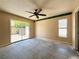 A bedroom with sliding glass door leads to the outside and a window at 2800 13Th N Ave, St Petersburg, FL 33713