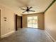 A bedroom with sliding glass door leads to the outside and has closet with bi-fold doors at 2800 13Th N Ave, St Petersburg, FL 33713