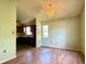 Dining room with a view into the kitchen, featuring tile floors and a chandelier at 2800 13Th N Ave, St Petersburg, FL 33713