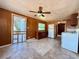 A kitchen with white appliances and wood paneled walls at 2800 13Th N Ave, St Petersburg, FL 33713