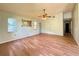 Open living room with tile floors, large windows, and a ceiling fan at 2800 13Th N Ave, St Petersburg, FL 33713