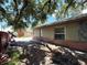 Side exterior view showcasing brick and stone accents and a large window at 2800 13Th N Ave, St Petersburg, FL 33713