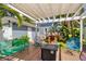 Backyard area with multiple seating, a fire pit, and tropical greenery at 304 21St N Ave, St Petersburg, FL 33704