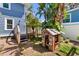 Backyard of house featuring a playhouse and a deck at 304 21St N Ave, St Petersburg, FL 33704