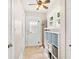 Hallway and mud room area featuring tiled floors, storage, coat rack and access to the outside at 304 21St N Ave, St Petersburg, FL 33704