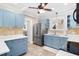 Cozy kitchen with blue cabinetry, stainless steel appliances, and stylish backsplash at 304 21St N Ave, St Petersburg, FL 33704