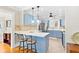 Modern kitchen with blue cabinetry, stainless steel appliances, and a breakfast bar, perfect for cooking and entertaining at 304 21St N Ave, St Petersburg, FL 33704