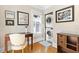 Laundry room and office nook with stackable washer/dryer, window and wooden floors at 304 21St N Ave, St Petersburg, FL 33704