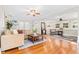 Open-concept living room with hardwood floors and ample seating, seamlessly connecting to other living areas at 304 21St N Ave, St Petersburg, FL 33704