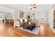 Bright living room with hardwood floors, a comfortable sofa, and large windows, creating a welcoming space at 304 21St N Ave, St Petersburg, FL 33704
