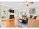Inviting living room with hardwood floors, a fireplace, and ample natural light, perfect for entertaining at 304 21St N Ave, St Petersburg, FL 33704