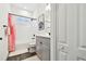 Bright bathroom with a shower and tub, and a grey vanity at 3326 Woodmont Dr, Parrish, FL 34219