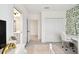 A brightly lit bedroom has closet access, a connected bath, and contemporary decor at 3326 Woodmont Dr, Parrish, FL 34219