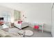 Bright bedroom with carpet, white furniture, string lights, and decorative vines at 3326 Woodmont Dr, Parrish, FL 34219