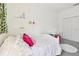 Bright bedroom with carpet, white furniture, string lights, and decorative vines at 3326 Woodmont Dr, Parrish, FL 34219