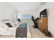 Large bedroom featuring a treadmill, bright windows, and a walk-in closet at 3326 Woodmont Dr, Parrish, FL 34219
