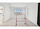 Bright bonus room with two windows and space for activities at 3326 Woodmont Dr, Parrish, FL 34219