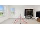 Spacious bonus room with lots of natural light and a ping pong table at 3326 Woodmont Dr, Parrish, FL 34219