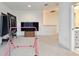 Large bonus room featuring a mounted TV and space for entertaining at 3326 Woodmont Dr, Parrish, FL 34219