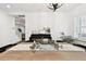 Bright dining room with view to entry stairs and living room, piano, decorative chandelier and modern furniture at 3326 Woodmont Dr, Parrish, FL 34219
