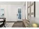 Entryway view featuring hardwood floors, a modern door and a decorative cabinet with mirrors at 3326 Woodmont Dr, Parrish, FL 34219