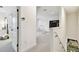 Upstairs hallway leading to a bonus room and overlooking the stairs at 3326 Woodmont Dr, Parrish, FL 34219