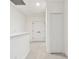 Upstairs hallway featuring multiple doors and lots of natural light at 3326 Woodmont Dr, Parrish, FL 34219