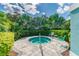 Relaxing hot tub surrounded by lush landscaping, providing an oasis of tranquility at 3326 Woodmont Dr, Parrish, FL 34219