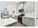 Contemporary kitchen with stylish cabinetry, stainless steel appliances, and bright countertops for culinary enthusiasts at 3326 Woodmont Dr, Parrish, FL 34219
