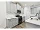 Modern kitchen showcasing sleek cabinets, black appliances, and beautiful countertops for a great cooking experience at 3326 Woodmont Dr, Parrish, FL 34219