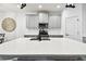 Close-up of the kitchen island showcasing quartz countertops and modern fixtures, adding a touch of elegance at 3326 Woodmont Dr, Parrish, FL 34219