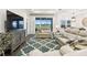 Comfortable living room showcasing leather seating, a rug, and a scenic view at 3326 Woodmont Dr, Parrish, FL 34219