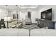 Inviting living room with furniture and gray accent cabinets, showcasing an open layout at 3326 Woodmont Dr, Parrish, FL 34219