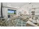Inviting living area showcasing a lake view, kitchen, and dining area at 3326 Woodmont Dr, Parrish, FL 34219