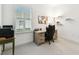 Bright office featuring a desk, chair, and a window with light-filtering shutters at 3326 Woodmont Dr, Parrish, FL 34219