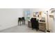 Bright office space featuring a desk, chair, shelving, and a window at 3326 Woodmont Dr, Parrish, FL 34219