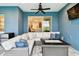 Outdoor patio features stylish furniture, fire table, and mounted TV for entertaining at 3326 Woodmont Dr, Parrish, FL 34219