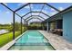 Spacious pool area with a serene lake view at 3326 Woodmont Dr, Parrish, FL 34219