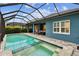 Screened pool with brick patio at 3326 Woodmont Dr, Parrish, FL 34219