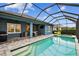 Backyard pool area has patio seating at 3326 Woodmont Dr, Parrish, FL 34219
