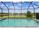 Screened pool offers relaxing lake views at 3326 Woodmont Dr, Parrish, FL 34219