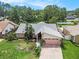 A home with lush landscaping and mature trees on a large lot at 3335 Foxridge Cir, Tampa, FL 33618