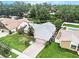 Aerial view of a well-maintained home with a lush lawn and mature trees at 3335 Foxridge Cir, Tampa, FL 33618