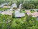 Residential neighborhood featuring mature trees and a tranquil pond at 3335 Foxridge Cir, Tampa, FL 33618