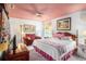 Cozy bedroom with soft carpet, ceiling fan, decorative accents, and comfy seating area at 3335 Foxridge Cir, Tampa, FL 33618
