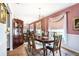 Formal dining room with an elegant chandelier, dark wood table, and cozy seating at 3335 Foxridge Cir, Tampa, FL 33618